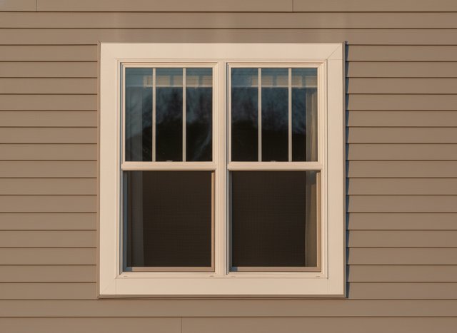A double-hung with the bottom sash raised — both sashes move, and both tilt in.