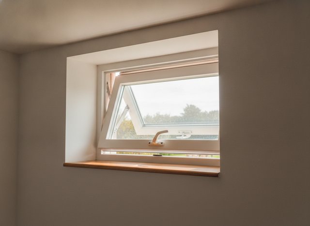 A hopper tilting in at the top — the basement workhorse that seals tight shut.